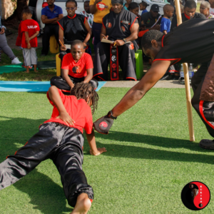 Kayla Receives Instruction From Student Instructor Oshane Bryant Towards The Execution Of 1 Arm Push Up