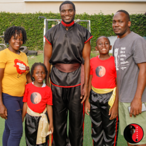 KUKIBO Student Instructor Oshane Bryant alongside students & parents