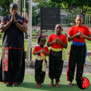 Grandmaster Bryan Campbell shows respect alongside students